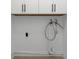 Practical laundry room with essential utility connections, ready for customization at 6508 Senegal Palm Way, Apollo Beach, FL 33572