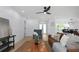 Bright living room with a ceiling fan, a comfortable seating area, and an open floor plan at 6508 Senegal Palm Way, Apollo Beach, FL 33572