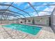 A screened pool with brick pavers offers a private oasis for relaxation and recreation at 6508 Senegal Palm Way, Apollo Beach, FL 33572