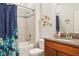 Well-maintained bathroom featuring a tiled shower and granite countertop at 6555 Sparkling Way, Wesley Chapel, FL 33545