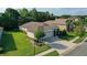 An exterior elevation shows a beautiful home with a manicured lawn and well-maintained landscaping at 6555 Sparkling Way, Wesley Chapel, FL 33545