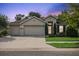 Charming single-story home with a three-car garage and well-manicured lawn at 6555 Sparkling Way, Wesley Chapel, FL 33545