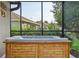 Covered screened in hot tub offering a relaxing view of the backyard at 6555 Sparkling Way, Wesley Chapel, FL 33545