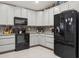 Modern kitchen with gray cabinetry, stainless steel appliances, and stylish tile backsplash at 6555 Sparkling Way, Wesley Chapel, FL 33545