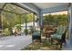 Relaxing screened lanai with comfortable seating overlooking the private backyard at 6555 Sparkling Way, Wesley Chapel, FL 33545