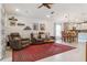 Spacious living room with hardwood floors, comfortable furniture, and stylish decor at 6555 Sparkling Way, Wesley Chapel, FL 33545