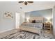 Bright and airy main bedroom showcasing a neutral color scheme and stylish furnishings at 6555 Sparkling Way, Wesley Chapel, FL 33545