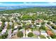 Stunning aerial view of the neighborhood, showcasing lush greenery and the nearby bay at 7092 119Th St, Seminole, FL 33772