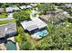 Aerial view of a home with backyard pool, showcasing the property's layout within a neighborhood setting at 7092 119Th St, Seminole, FL 33772