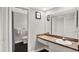 Bathroom featuring a wood countertop, white vanity, and access to the toilet and shower area at 7092 119Th St, Seminole, FL 33772