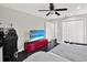 Bedroom featuring a bed, TV, and desk with chair at 7092 119Th St, Seminole, FL 33772