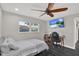 Bedroom featuring a bed, TV, desk, chair, and window at 7092 119Th St, Seminole, FL 33772
