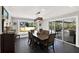 Spacious dining area with natural light, dark floors, and a modern light fixture at 7092 119Th St, Seminole, FL 33772