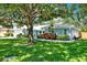 Charming single-Gathering home with well-manicured lawn, mature trees, and lovely landscaping at 7092 119Th St, Seminole, FL 33772
