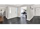 Bright foyer features dark floors, a glass front door, and seamless transition to the office and dining area at 7092 119Th St, Seminole, FL 33772