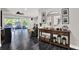 Spacious living room with dark floors, recessed lighting, and seamless access to the outdoor patio at 7092 119Th St, Seminole, FL 33772