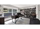 Bright home office space featuring a large window, desk, and built-in bookshelves at 7092 119Th St, Seminole, FL 33772