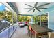 Inviting screened porch with comfortable seating and large table, perfect for outdoor dining and relaxation at 7092 119Th St, Seminole, FL 33772