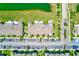 This aerial view highlights community parking and landscaping near green spaces and walkways at 727 Kensington Lake Cir, Brandon, FL 33511