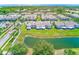 Aerial view highlighting the community's green spaces, water features, and building exteriors at 727 Kensington Lake Cir, Brandon, FL 33511
