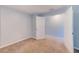 A spacious carpeted bedroom has an entry doorway and an open closet at 727 Kensington Lake Cir, Brandon, FL 33511