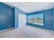 Bedroom with a large window overlooking the pond providing plenty of natural light at 727 Kensington Lake Cir, Brandon, FL 33511