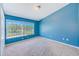 Spacious bedroom with a large window offering natural light and scenic views at 727 Kensington Lake Cir, Brandon, FL 33511