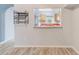 Bright dining room with tile floors open to the kitchen through an interior window at 727 Kensington Lake Cir, Brandon, FL 33511