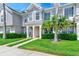 Charming front entrance with a well-manicured lawn and a welcoming walkway to the front door at 727 Kensington Lake Cir, Brandon, FL 33511