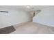 Spacious living room with carpet floors, neutral paint and stairs leading to the upper level at 727 Kensington Lake Cir, Brandon, FL 33511