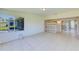 Sunroom featuring tile flooring and sliding door access to the interior of the home at 727 Kensington Lake Cir, Brandon, FL 33511