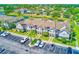 Aerial view of townhomes with assigned parking and palm tree landscaping at 727 Kensington Lake Cir, Brandon, FL 33511