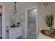 Charming half bathroom featuring a vintage vanity, decorative mirror, and unique copper sink at 7600 Drew Oak Dr, Seminole, FL 33772