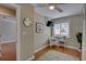 A bedroom with hardwood floors, a ceiling fan, and a mounted TV at 7600 Drew Oak Dr, Seminole, FL 33772