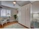 Bedroom with hardwood floors, a ceiling fan, and a Murphy bed at 7600 Drew Oak Dr, Seminole, FL 33772