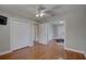 A bedroom with hardwood floors and doors leading to other rooms at 7600 Drew Oak Dr, Seminole, FL 33772
