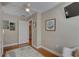 A bedroom with hardwood floors, a ceiling fan, and artwork at 7600 Drew Oak Dr, Seminole, FL 33772