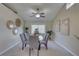 Bright dining room with neutral walls, carpet, and views to living room for an inviting atmosphere at 7600 Drew Oak Dr, Seminole, FL 33772