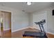 Exercise room with hardwood floors with access to the other room at 7600 Drew Oak Dr, Seminole, FL 33772