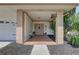 Inviting covered front porch with brick accents, cozy seating, and decorative details at 7600 Drew Oak Dr, Seminole, FL 33772