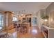 Bright kitchen featuring an island with seating, stainless appliances, hardwood floors, and wooden cabinetry at 7600 Drew Oak Dr, Seminole, FL 33772