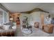 Cozy living room featuring neutral walls, carpet, ample seating, and contemporary decor for a relaxing ambiance at 7600 Drew Oak Dr, Seminole, FL 33772