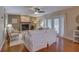 Cozy living room featuring a fireplace, neutral walls, hardwood floors, and comfortable seating at 7600 Drew Oak Dr, Seminole, FL 33772