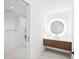 Stylish bathroom featuring a floating vanity with a round LED mirror and open access to the shower/tub at 777 3Rd N Ave # 905, St Petersburg, FL 33701