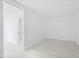 Minimalist bedroom with light tile flooring and a sliding door to an adjoining room at 777 3Rd N Ave # 905, St Petersburg, FL 33701