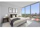 Serene bedroom featuring a soft color palette and a scenic city view at 777 3Rd N Ave # 905, St Petersburg, FL 33701