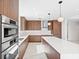 Sleek kitchen featuring stainless steel appliances and a waterfall island at 777 3Rd N Ave # 905, St Petersburg, FL 33701