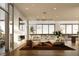 Sleek living room featuring a fireplace, hardwood floors, stylish furnishings and a wall of windows at 777 3Rd N Ave # 905, St Petersburg, FL 33701