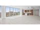 Open living space featuring floor-to-ceiling windows and a modern kitchen at 777 3Rd N Ave # 905, St Petersburg, FL 33701