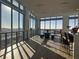 Bright, spacious lounge area with floor-to-ceiling windows, modern decor, and panoramic city views at 777 3Rd N Ave # 905, St Petersburg, FL 33701